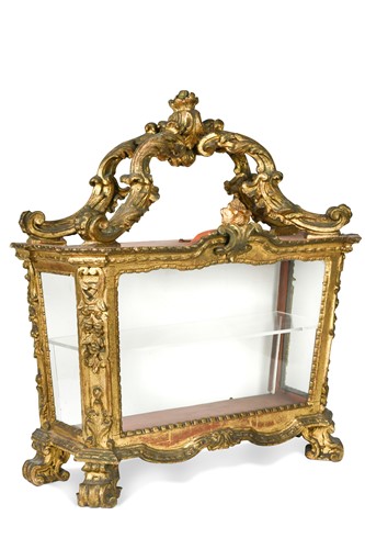 Lot 296 - A Continental carved and giltwood table display cabinet