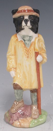 Lot 36 - A Beswick sheepdog, holding crook dressed in...