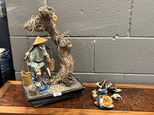 Lot 47 - A modern Chinese ceramic model fisherman in...