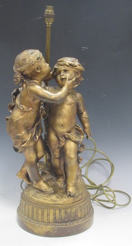 Lot 35 - A large gilt metal figure group of two young...