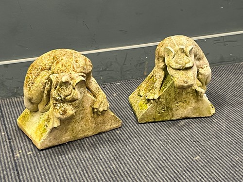 Lot 481 - A pair of weathered cast stone gate post...
