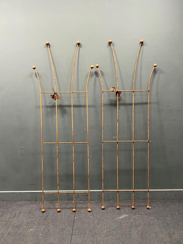 Lot 484 - A pair of hand forged iron honey suckle garden...