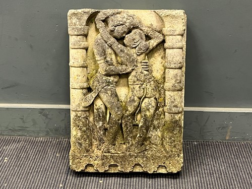 Lot 478 - A weathered cast stone wall plaque, depicting...