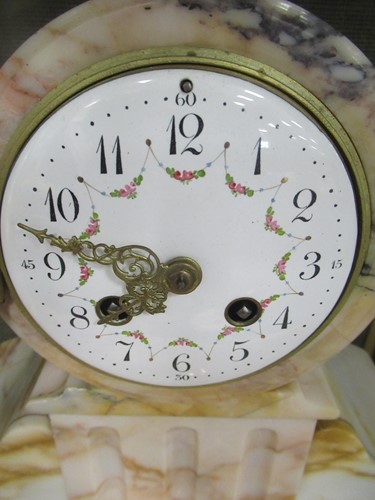 Lot 14 - A French clock garniture, comprising a painted...