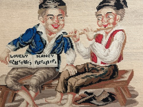 Lot 87 - A woolwork picture of two smiling urchins...