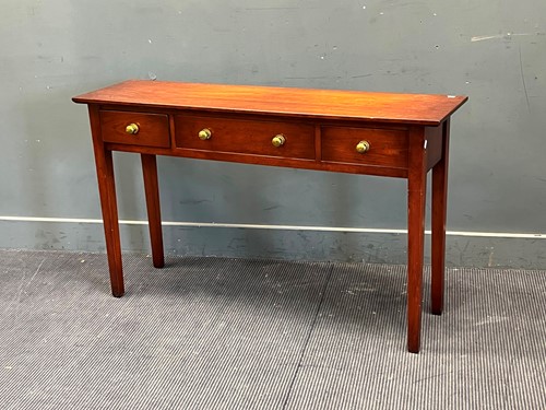 Lot 378 - A modern cherry wood console table with three...