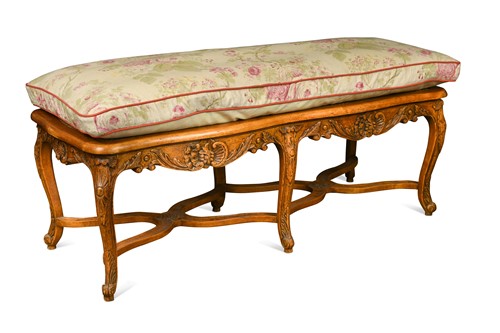 Lot 724 - A French Louis XV style walnut and caned rectangular stool