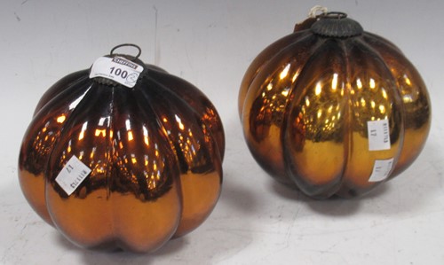 Lot 100 - A pair of orange glass Christmas decorations