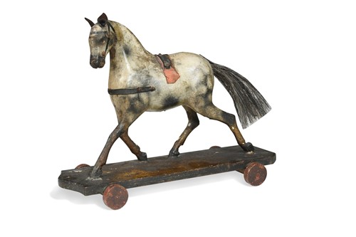 Lot 194 - A papier-mache dappled horse pull-toy, circa 1900