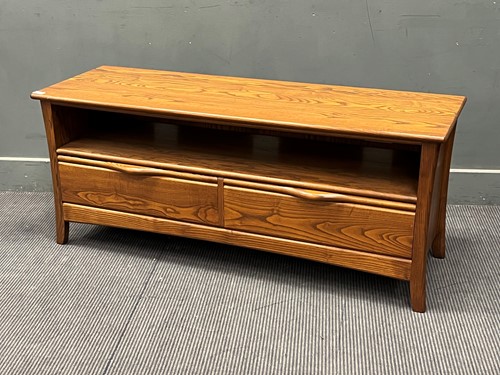 Lot 474 - An Ercol stained elm sideboard 55 x 133 x 44cm