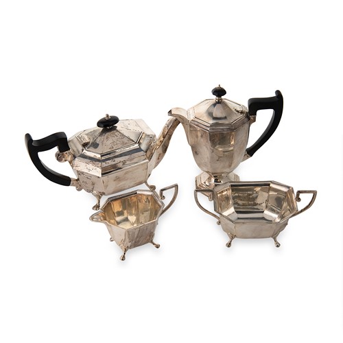 Lot 409 - A George V silver three-piece tea set with one addition
