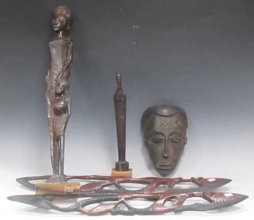 Lot 184 - A collection of carved African tribal objects...