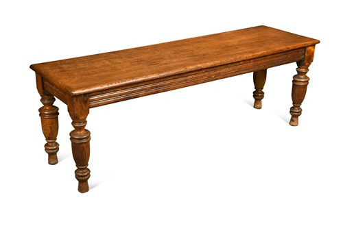 Lot 599 - A late Victorian golden oak hall bench