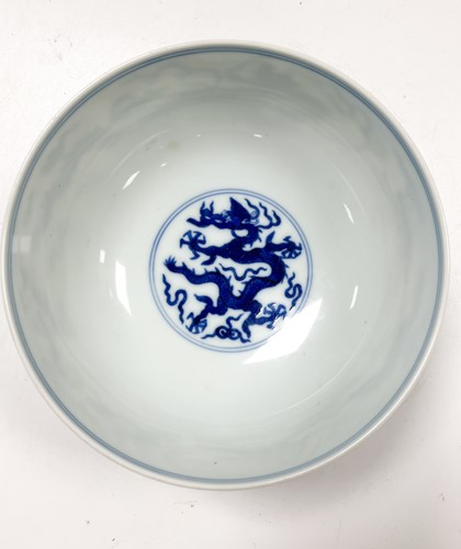 Lot 17 - A Chinese blue and white porcelain dragon bowl, bearing seal mark of Daoguang