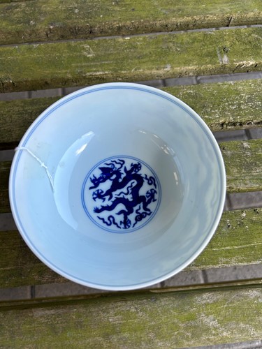 Lot 17 - A Chinese blue and white porcelain dragon bowl, bearing seal mark of Daoguang