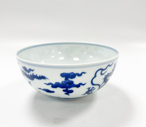 Lot 17 - A Chinese blue and white porcelain dragon bowl, bearing seal mark of Daoguang