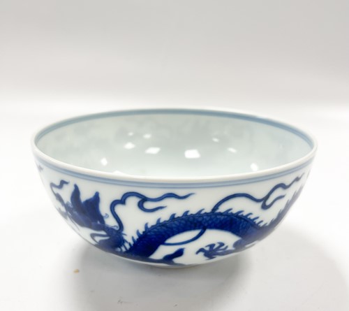 Lot 17 - A Chinese blue and white porcelain dragon bowl, bearing seal mark of Daoguang