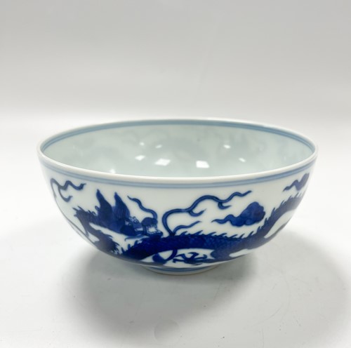 Lot 17 - A Chinese blue and white porcelain dragon bowl, bearing seal mark of Daoguang