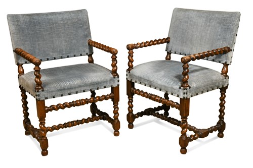 Lot 45 - A pair of walnut elbow chairs in the 17th century style