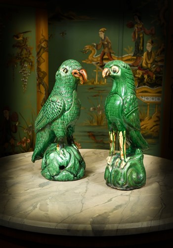 Lot 325 - A composed pair of pottery parrots, 20th century