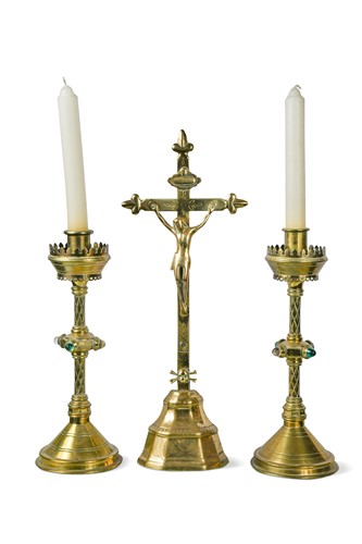 Lot 137 - A pair of Victorian brass Reformed Gothic altar sticks