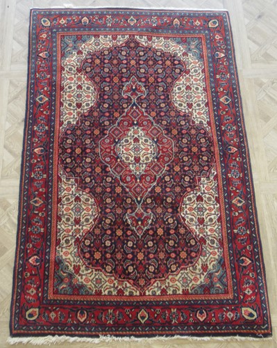 Lot 701 - A Persian rug 164cm x 105cm