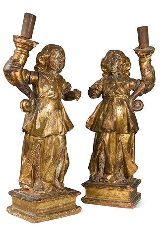 Lot 40 - A pair of carved and gilded figural candlesticks, 17th century