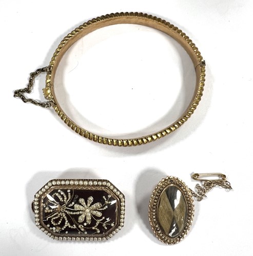 Lot 327 - A hallmarked 9ct gold bangle, together with...