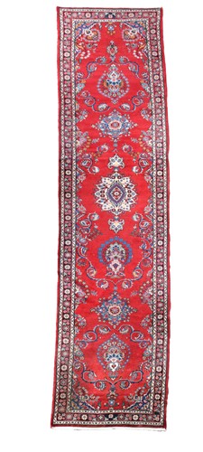 Lot 165 - A long Sarouk runner, circa 1960