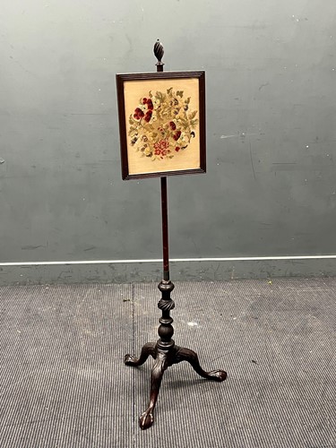 Lot 585 - A George III style mahogany pole screen, the...