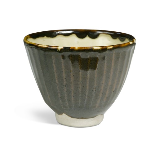 Lot 55 - Bernard Leach (1887-1979), a St. Ives cut-sided bowl, circa 1960