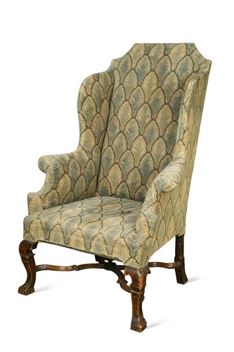 Lot 521 - A Queen Anne walnut wingback armchair