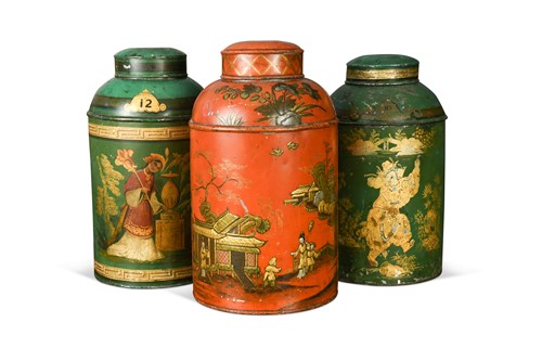 Lot 487 - A collection of three toleware tea canisters with covers, 19th century