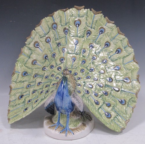 Lot 72 - A large ceramic peacock, continental. 37cms High