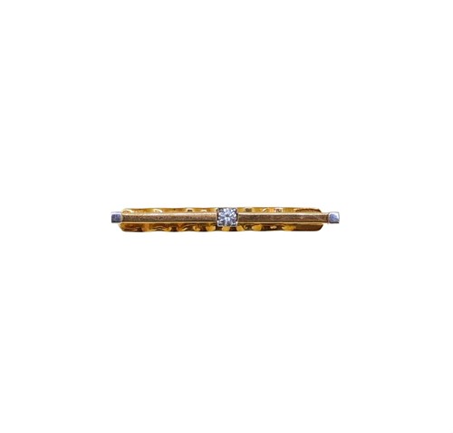 Lot 77 - An 18ct gold diamond set tie slide