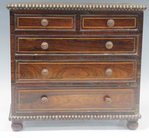 Lot 161 - A 19th century rosewood miniature chest of...