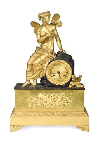 Lot 679 - A French Empire gilt metal mantel clock, 19th century