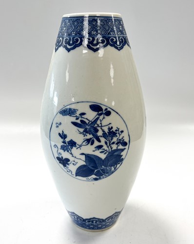 Lot 7 - A Chinese blue and white porcelain skittle vase, Qing Dynasty, 18th century