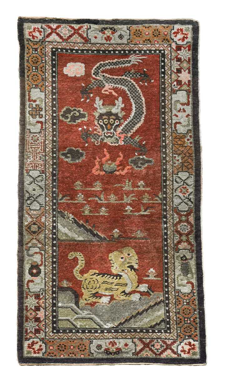 Lot 450 - A Sino-Tibetan wool rug, early 20th century