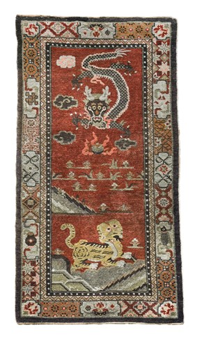 Lot 80 - A Sino-Tibetan wool rug, early 20th century