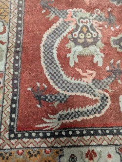Lot 450 - A Sino-Tibetan wool rug, early 20th century