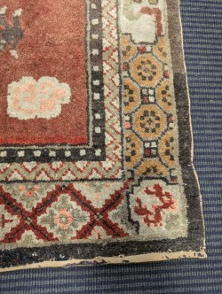Lot 450 - A Sino-Tibetan wool rug, early 20th century