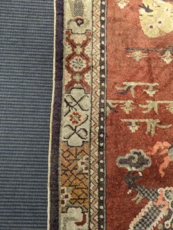 Lot 450 - A Sino-Tibetan wool rug, early 20th century