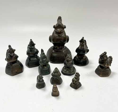 Lot 96 - A set of eleven Burmese 'opium' weights, 19th century