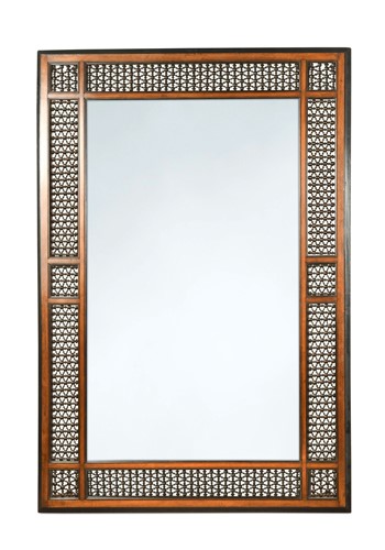 Lot 634 - A large walnut and ebonised Liberty style wall mirror, circa 1900