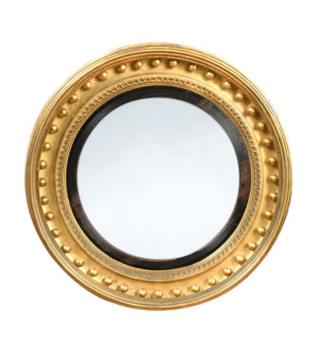 Lot 744 - A large Regency giltwood convex mirror