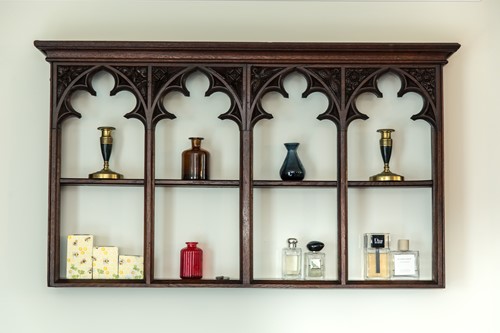 Lot 562 - An oak gothic revival hanging wall shelf, 19th century