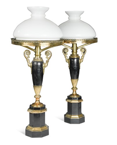 Lot 786 - A pair of Neo-classical style black painted and gilt metal table lamps, late 19th century