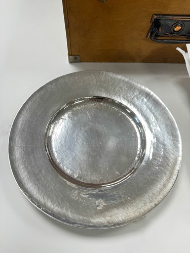 Lot 209 - Omar Ramsden, a near set of Twelve George V and Edward VIII silver dinner plates