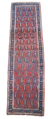 Lot 559 - A long Persian Karaja runner rug, circa 1920